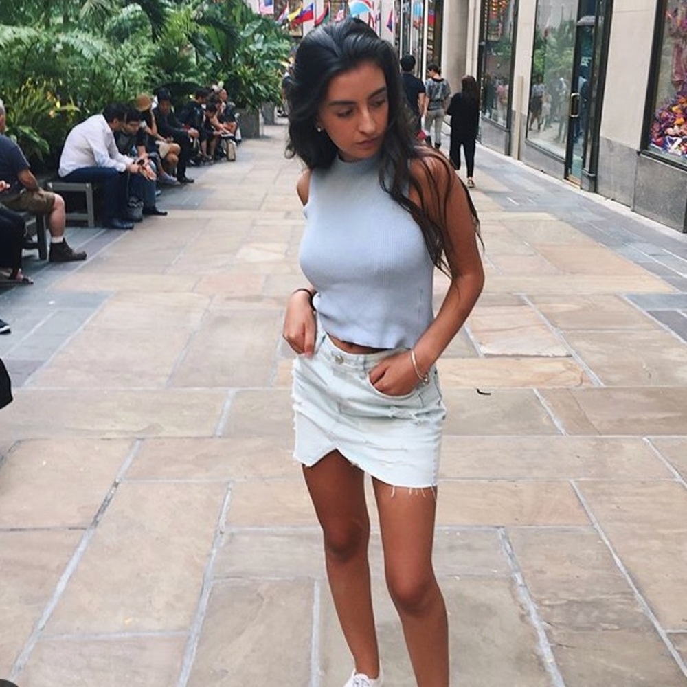 Light denim distressed skirt cutout in front